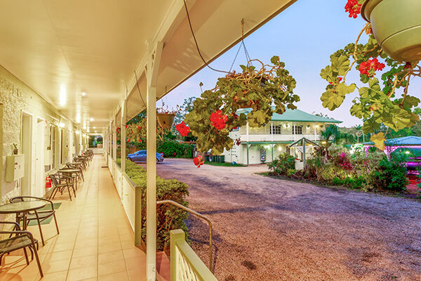 Gardens, patio, driveway and pergola at the Yungaburra Park Motel, Yungaburra, QLD